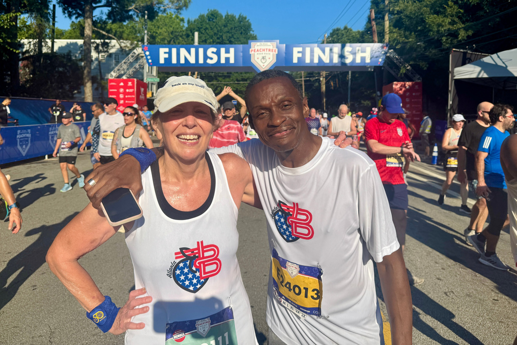 Back on My Feet members celebrating at a race finish line